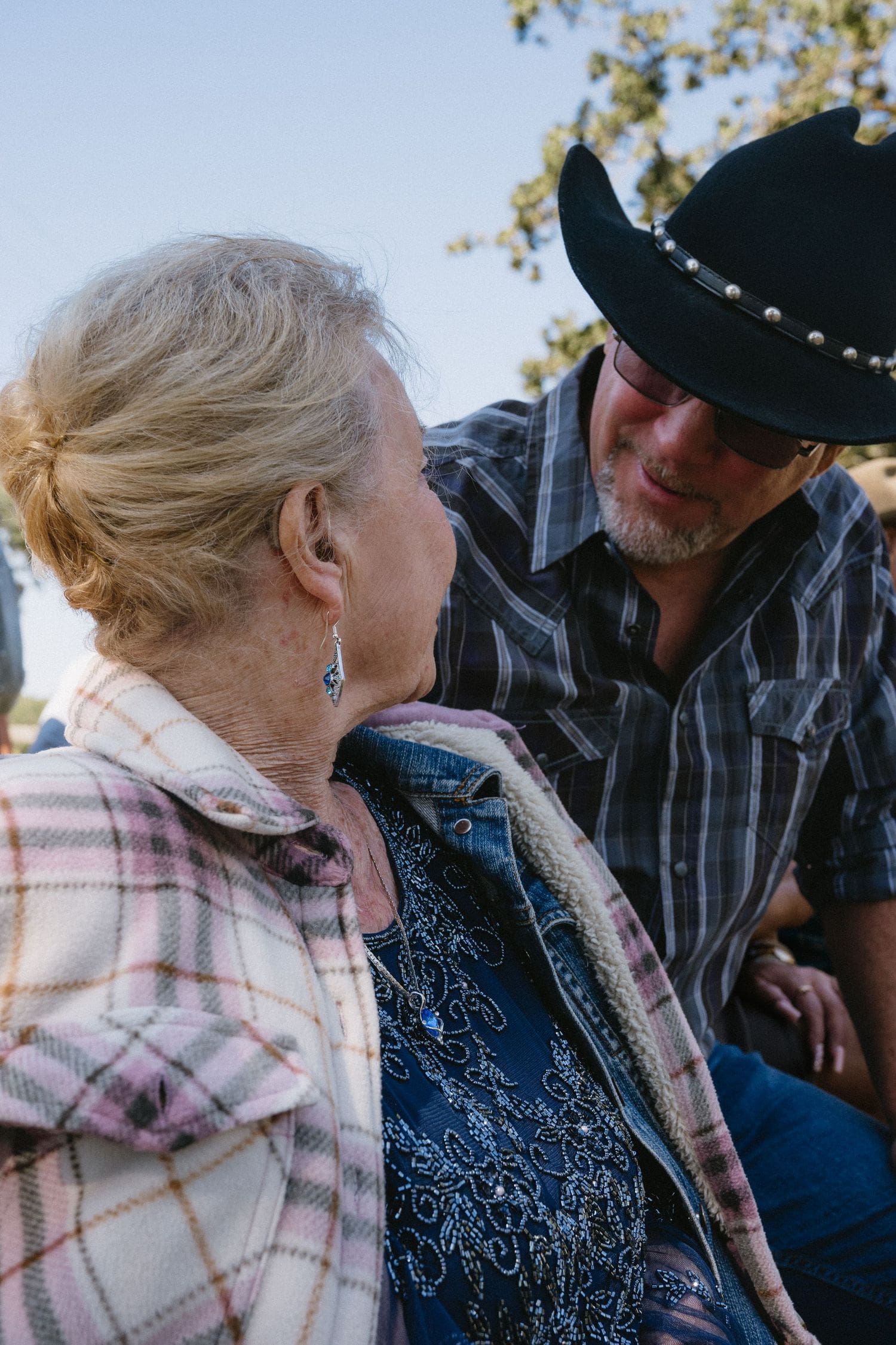 Elderly couple conversing outdoors during a wine country wedding celebration in Sebastopol